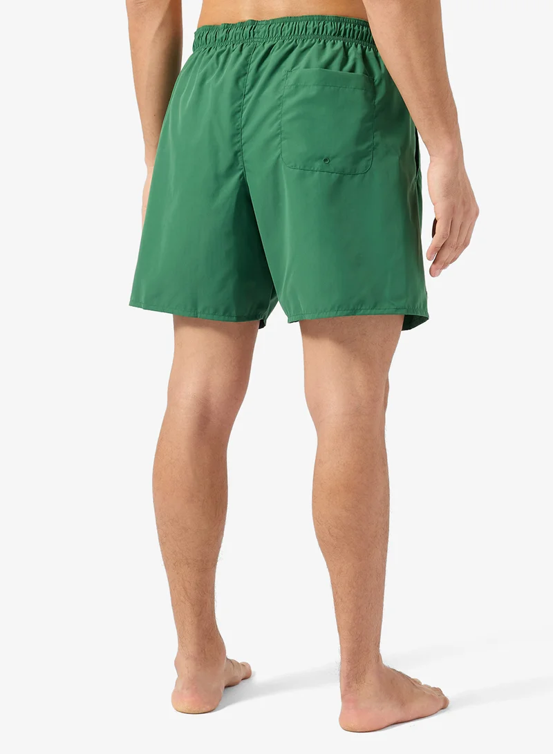 LACOSTE  Monochrome Swim Trunks for Men | Best Price UAE